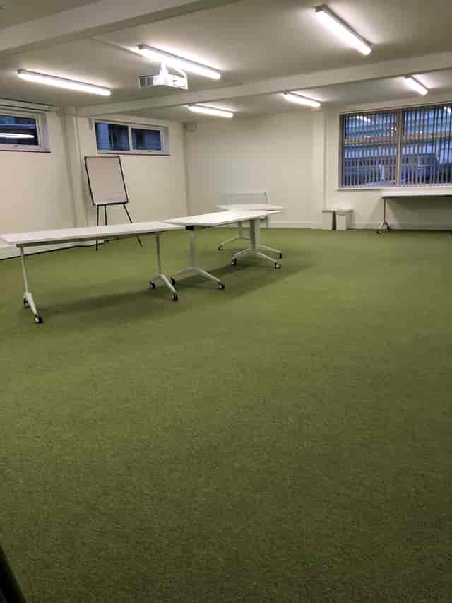 Versatile training room with movable tables, ideal for workshops in SEIDs Hub Wembley.