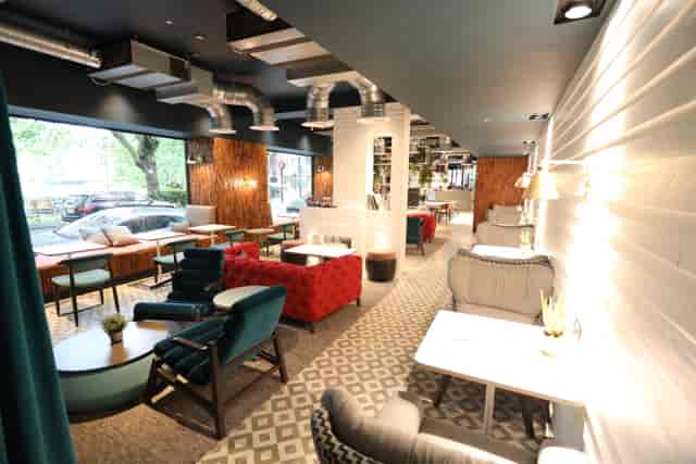 Modern event space with comfortable seating for casual meetings and networking.