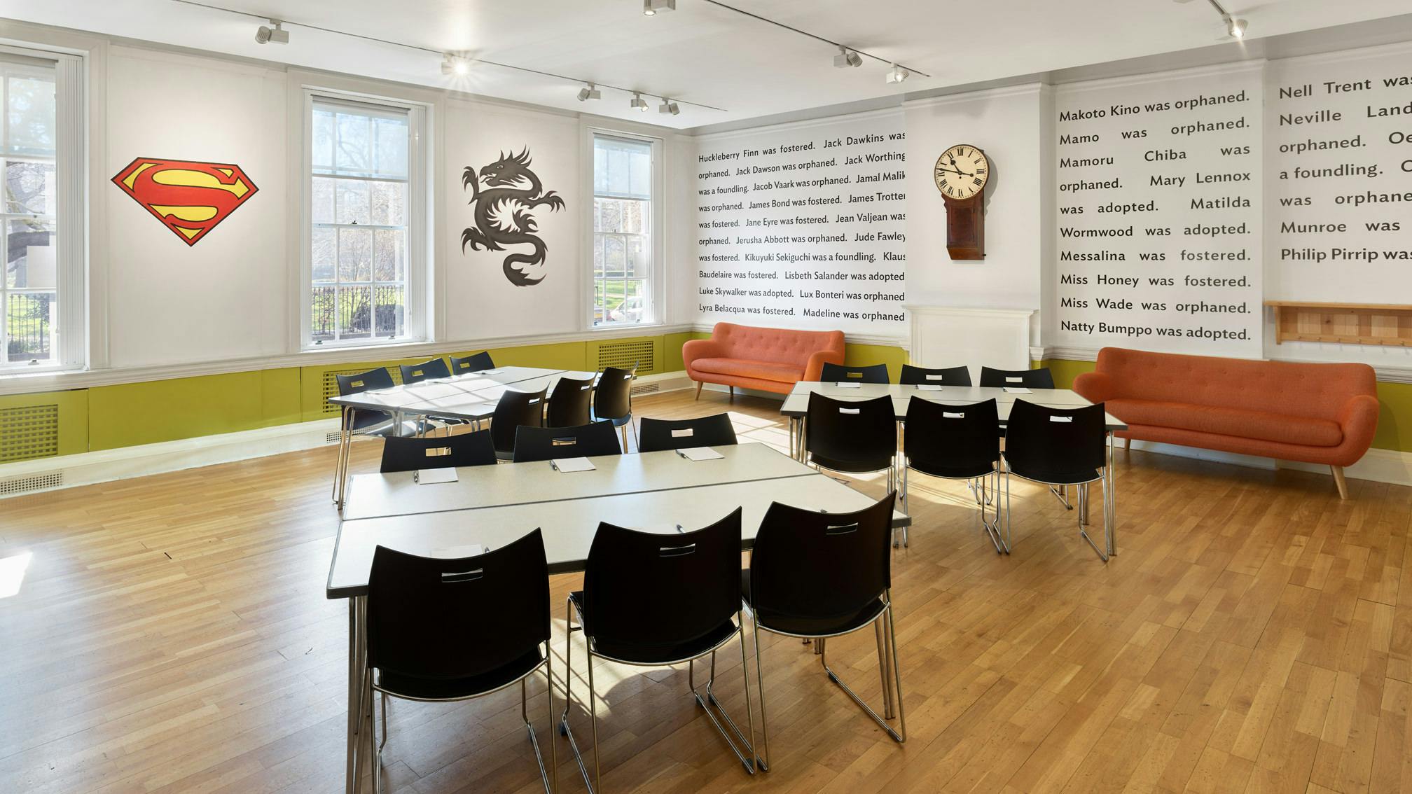 Versatile meeting space in The Foundling Museum with modern furniture and unique wall art.