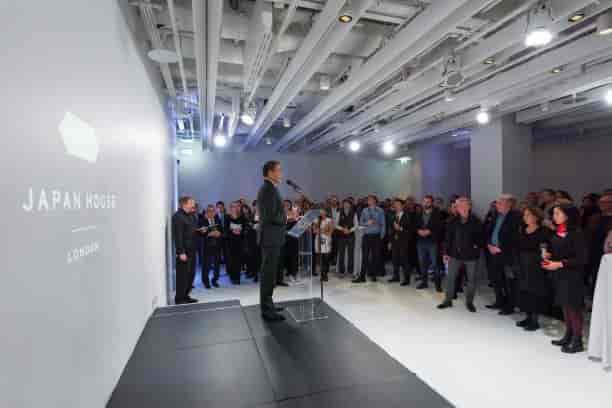 Engaged audience at Japan House London event with modern design and speaker.