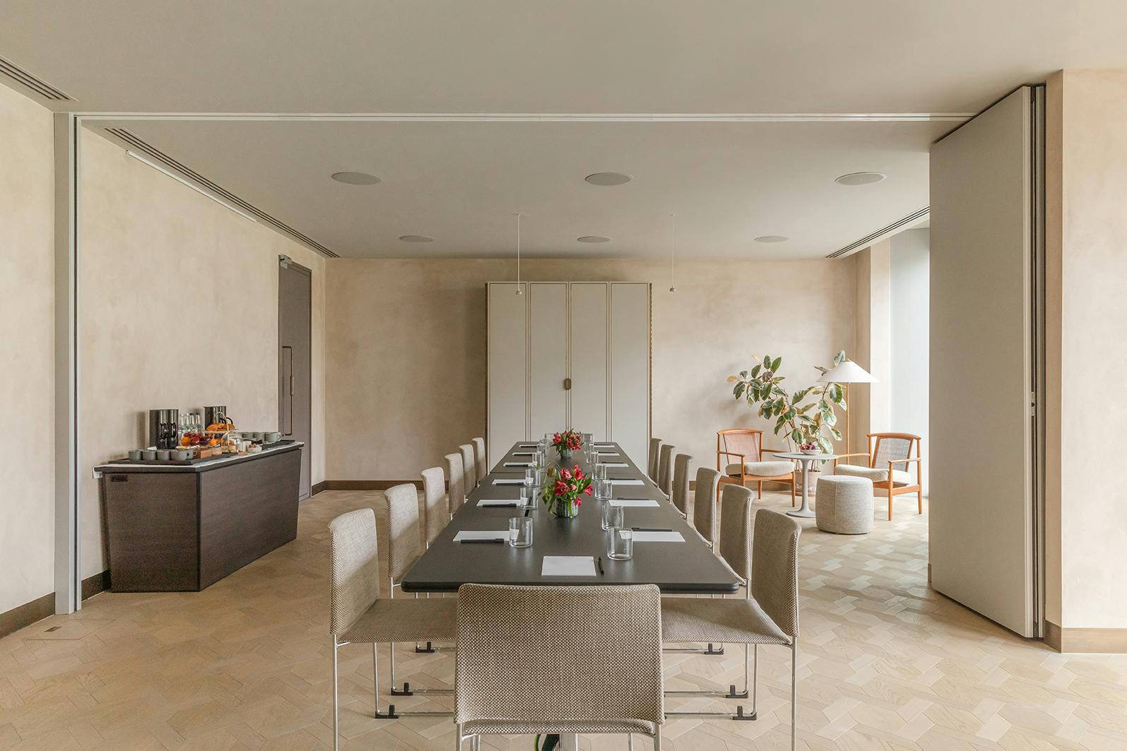 Modern meeting room at The Stratford, featuring a long table for professional events.