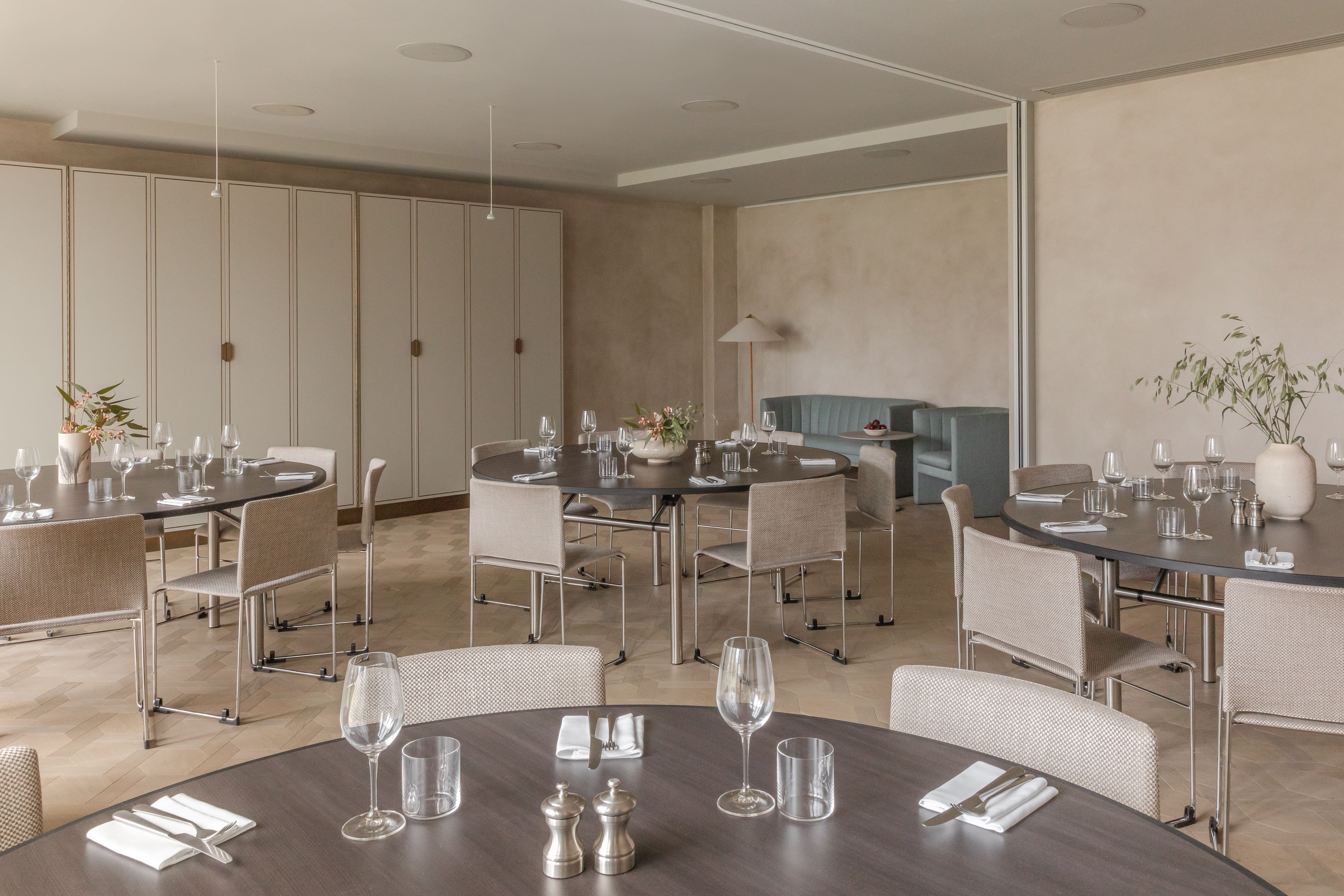 Sophisticated dining setup with elegant tables at The Stratford for intimate events. - Banner