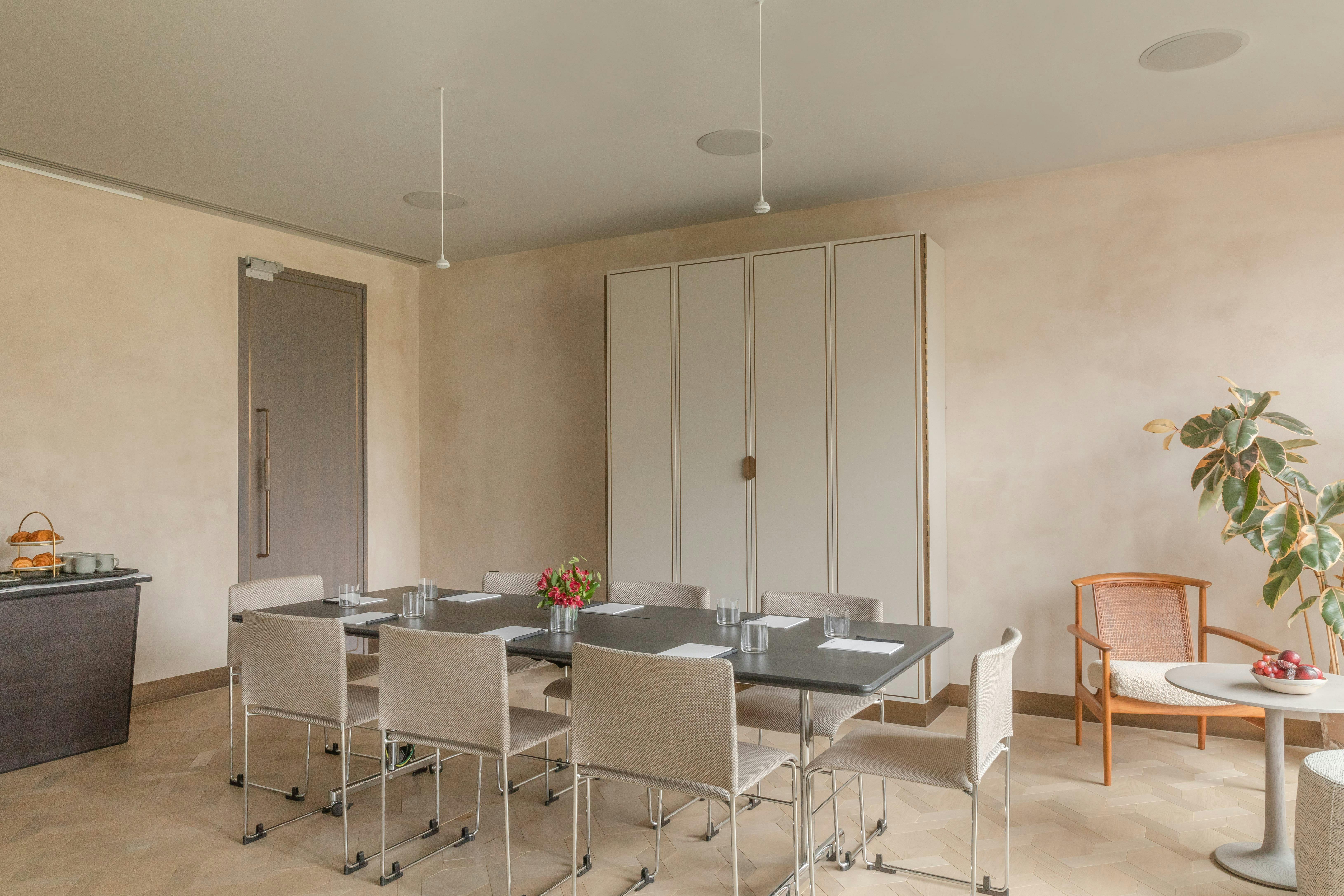 Modern meeting room at The Stratford, featuring a sleek table setup for productive events.