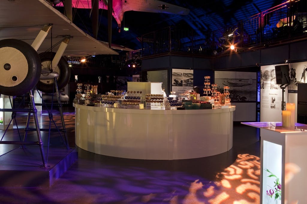 Flight event space with curved bar and aviation backdrop, perfect for networking functions.