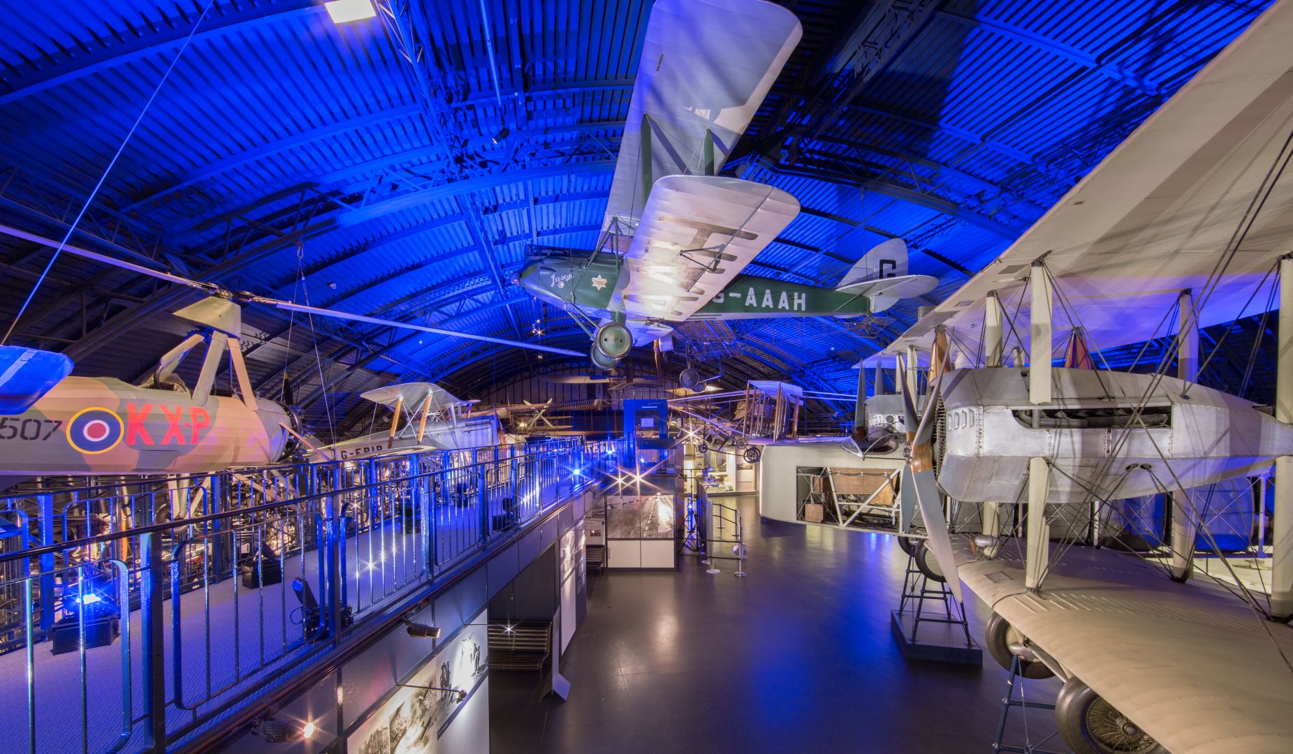 Vintage aircraft event space with blue lighting at The Science Museum for corporate gatherings. - Banner