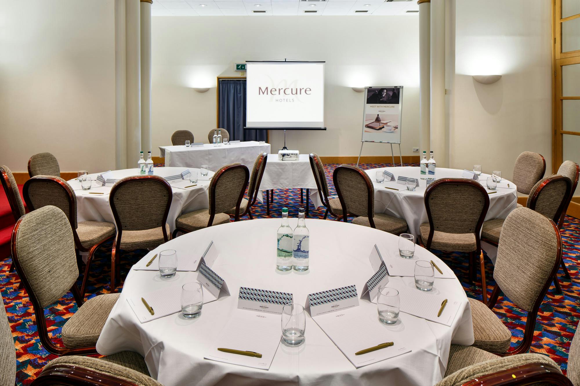 Norfolk Suite meeting room at Mercure Brighton, set for professional events with round tables.
