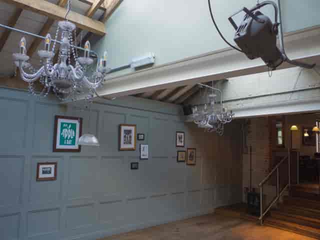 Stylish event space with chandeliers, perfect for meetings and gatherings at Adam & Eve.
