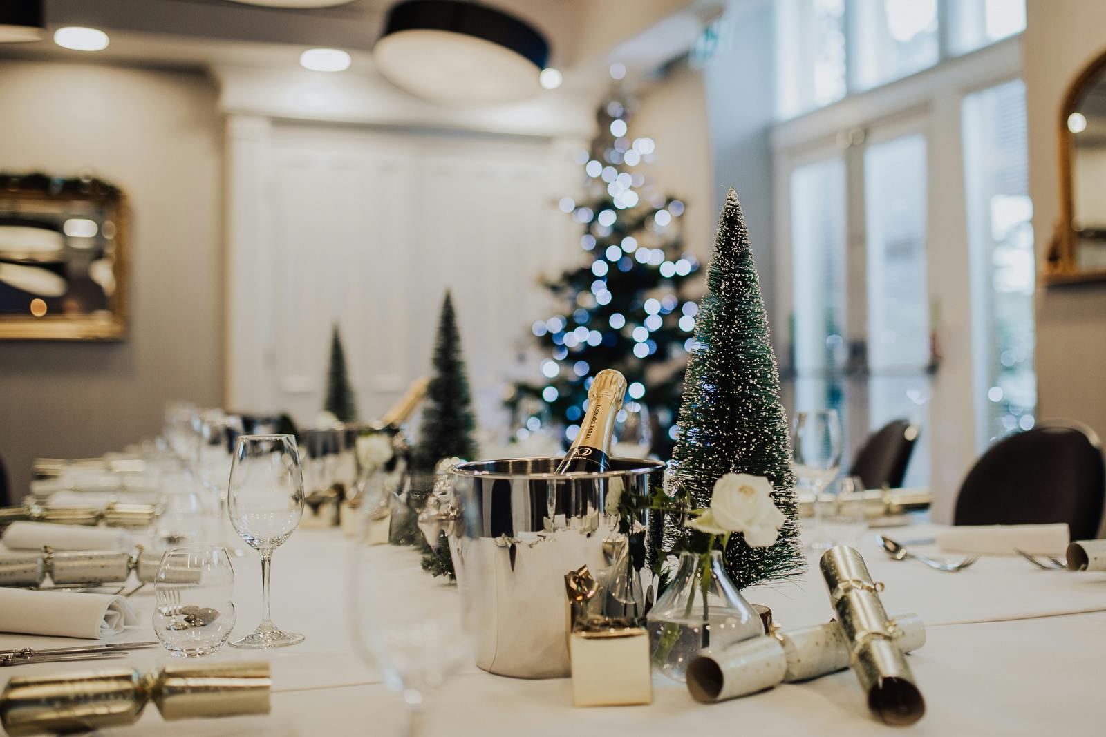 Elegant dining table with glassware for festive holiday gatherings at Oddfellows On The Park.