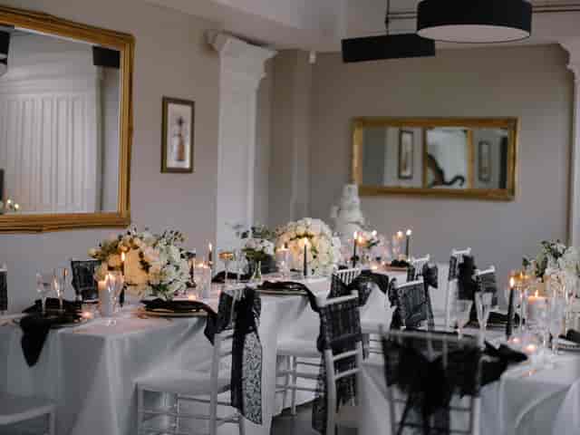 Elegant dining space with floral centerpieces, ideal for weddings and corporate events.