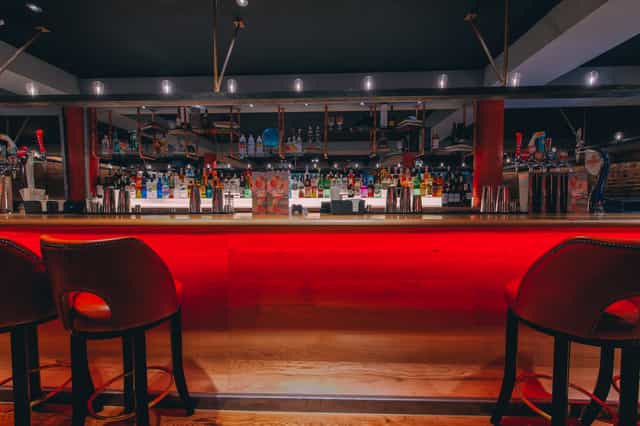Sleek Skye Bar in Glasgow with illuminated counter for networking events and social gatherings.