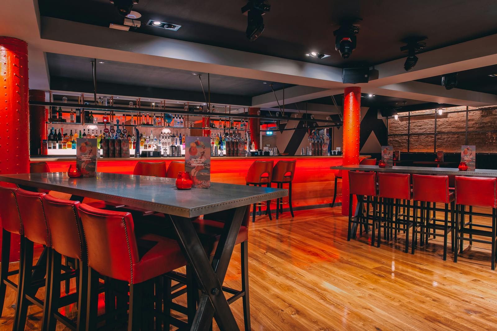 Modern Skye Bar in Glasgow with vibrant red accents, ideal for networking events.