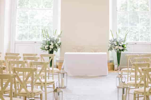 Elegant wedding venue at Prince Philip House with white floral arrangements.