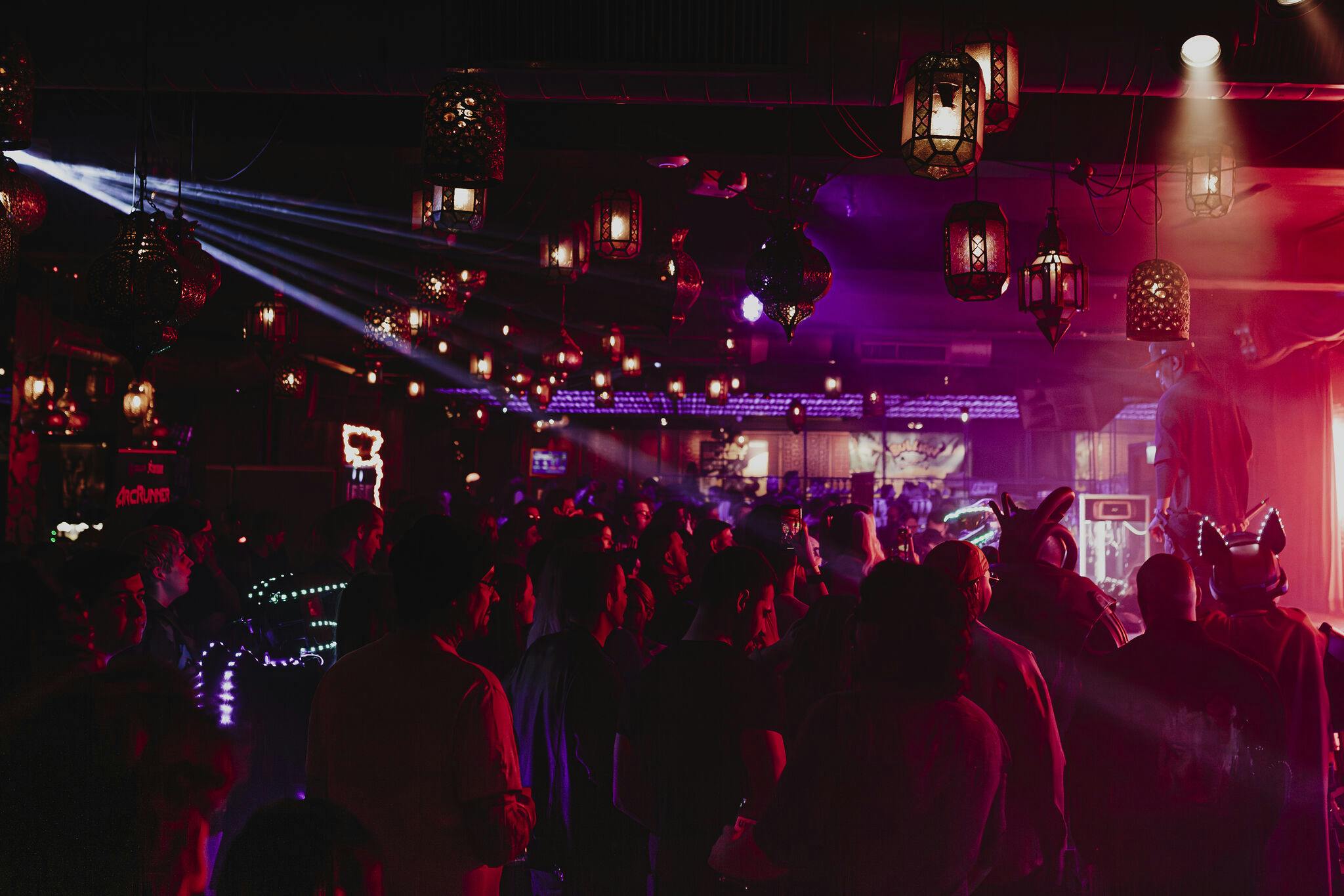 Vibrant event space at Impossible Theatre with festive lighting for networking and celebrations.