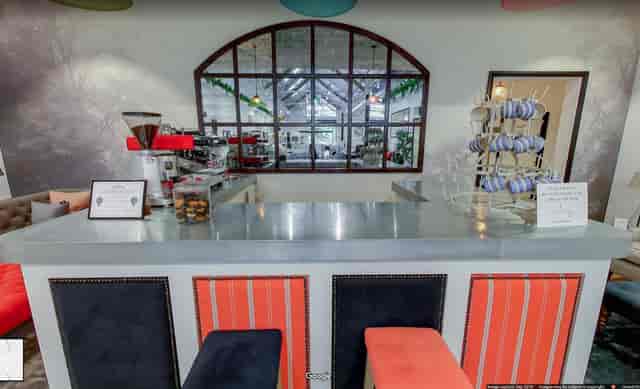 Stylish event space at Sofa.com Harrogate with modern seating and bar for gatherings.