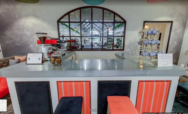 Stylish event space at Sofa.com Harrogate with modern seating and bar for gatherings.
