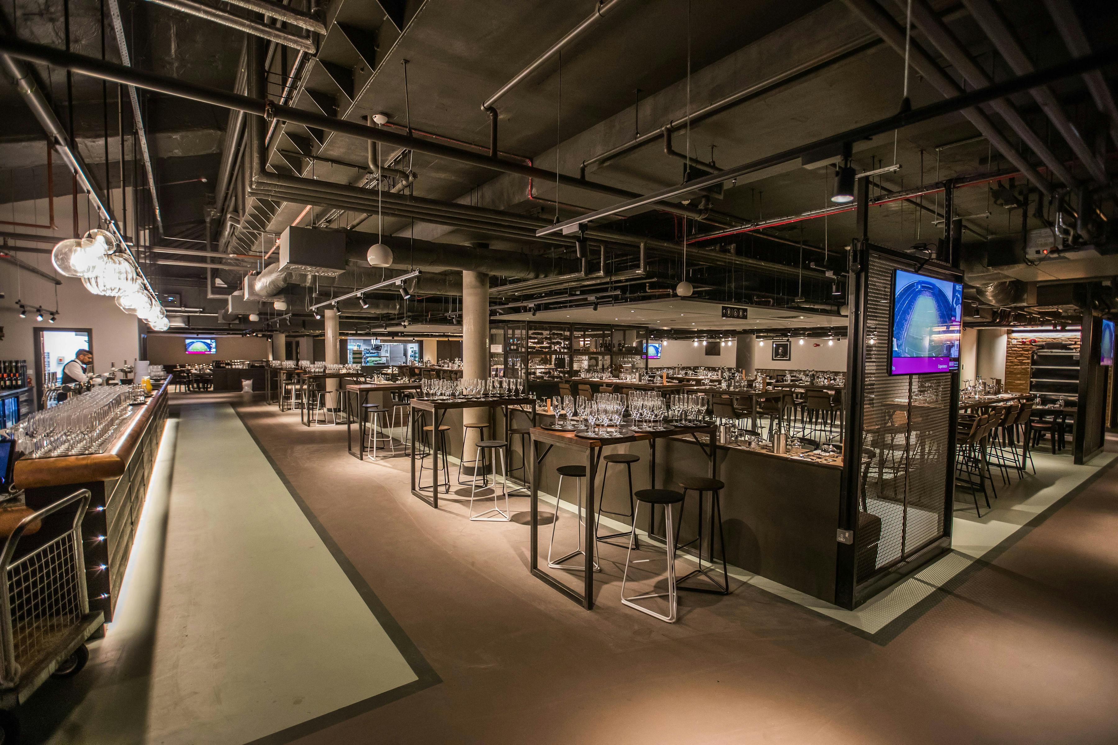 Modern event space at Allianz Stadium, Twickenham with sleek furnishings and ample seating.