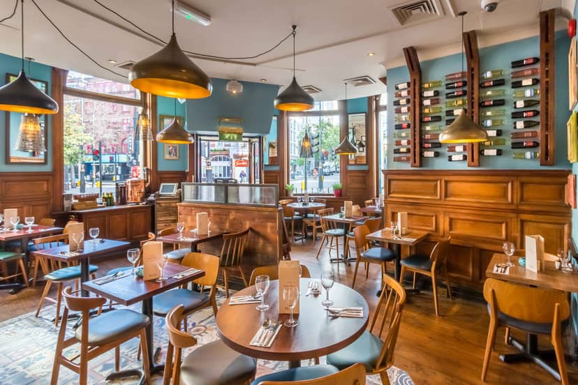 Stylish restaurant venue with warm wood tones, ideal for events and meetings.