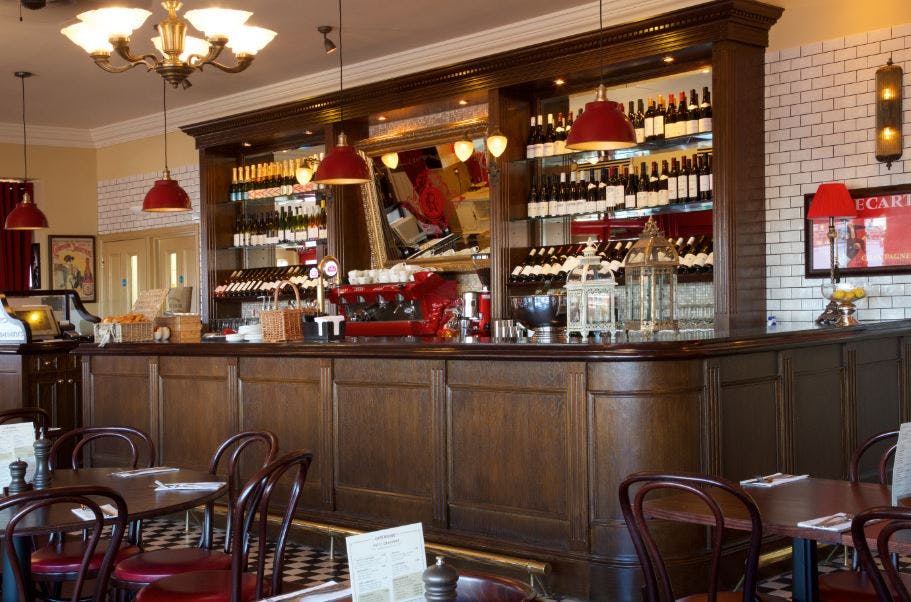 Café Rouge Birmingham Mailbox: cozy venue with wine display for meetings and events.