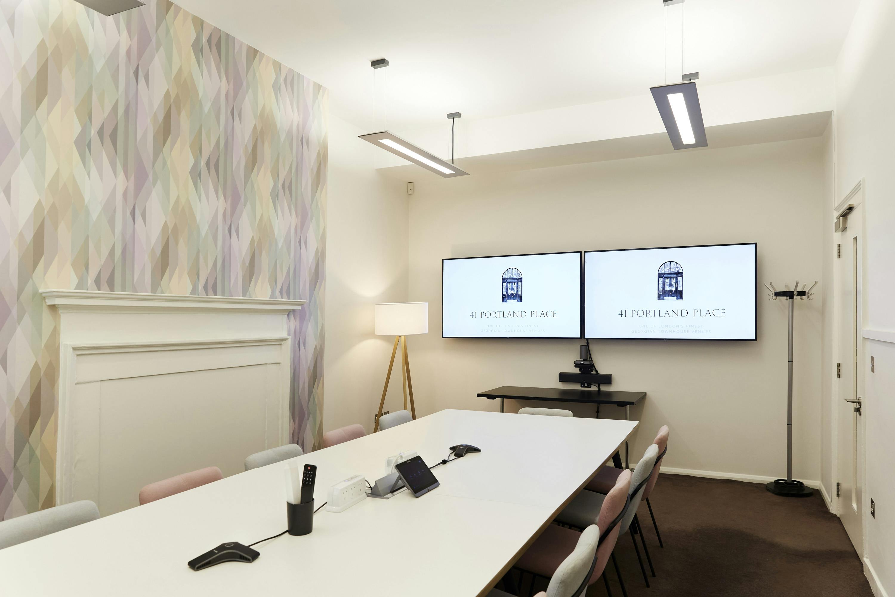 Modern Curie Boardroom with long table, ideal for meetings and events at 41 Portland Place.