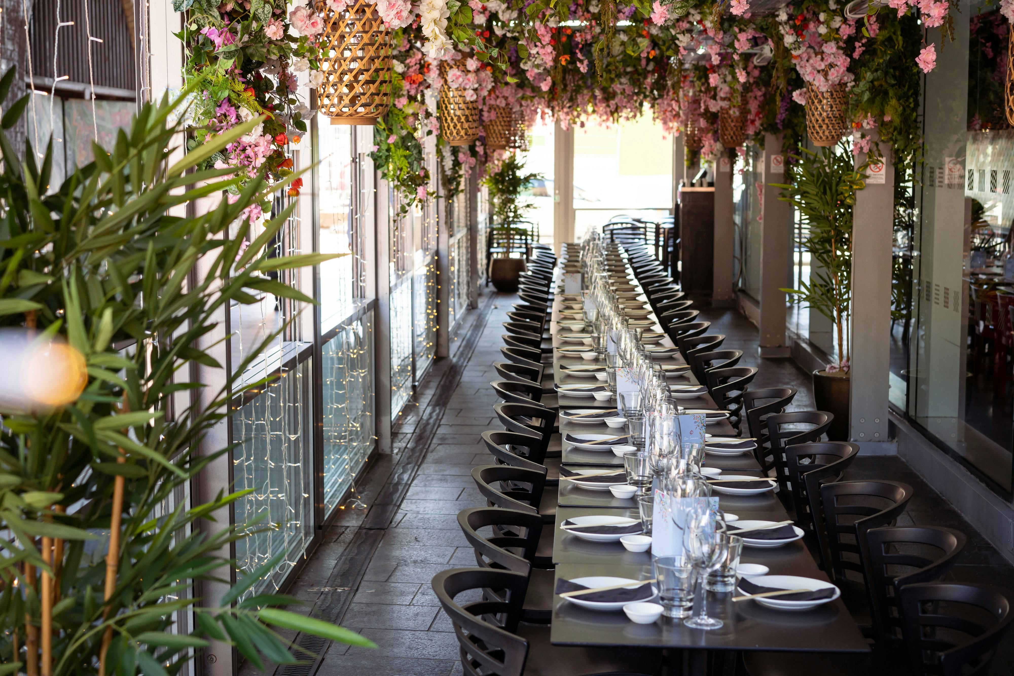 Cherry Blossom Private Terrace dining setup with floral decor for elegant events.