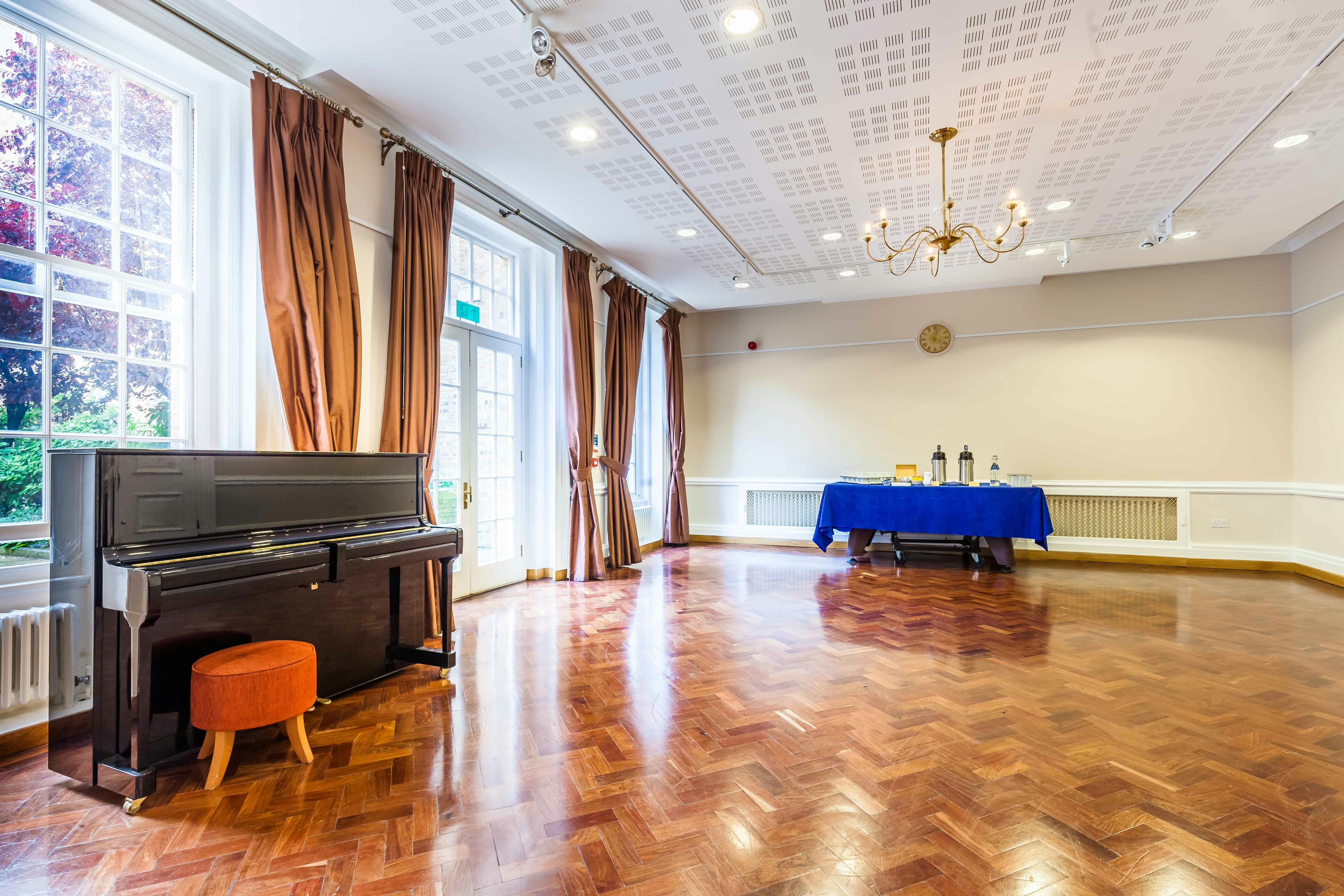 William Goodenough Small Common Room with piano, ideal for meetings and gatherings.