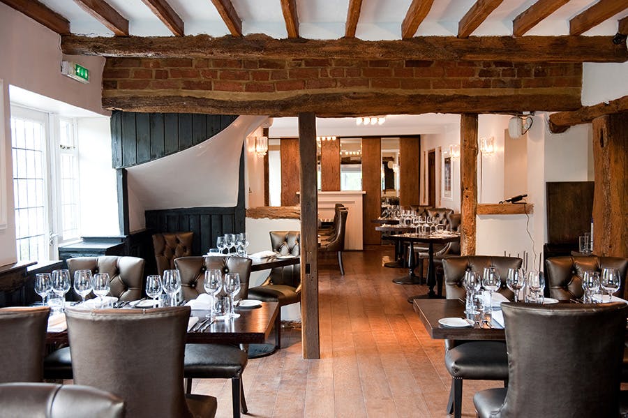 Mole & Badger Restaurant: elegant dining space with warm wood accents for events.