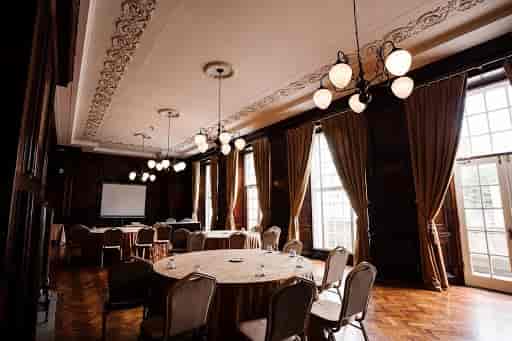 Elegant meeting space in Manchester Hall with natural light, perfect for corporate events.