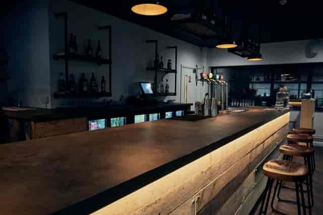 Modern bar setup with warm lighting for networking events at Graystone Manchester.