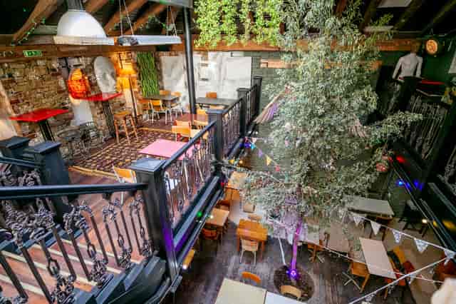 Private Mezzanine at Owl & Hitchhiker: rustic charm venue for intimate gatherings and events.