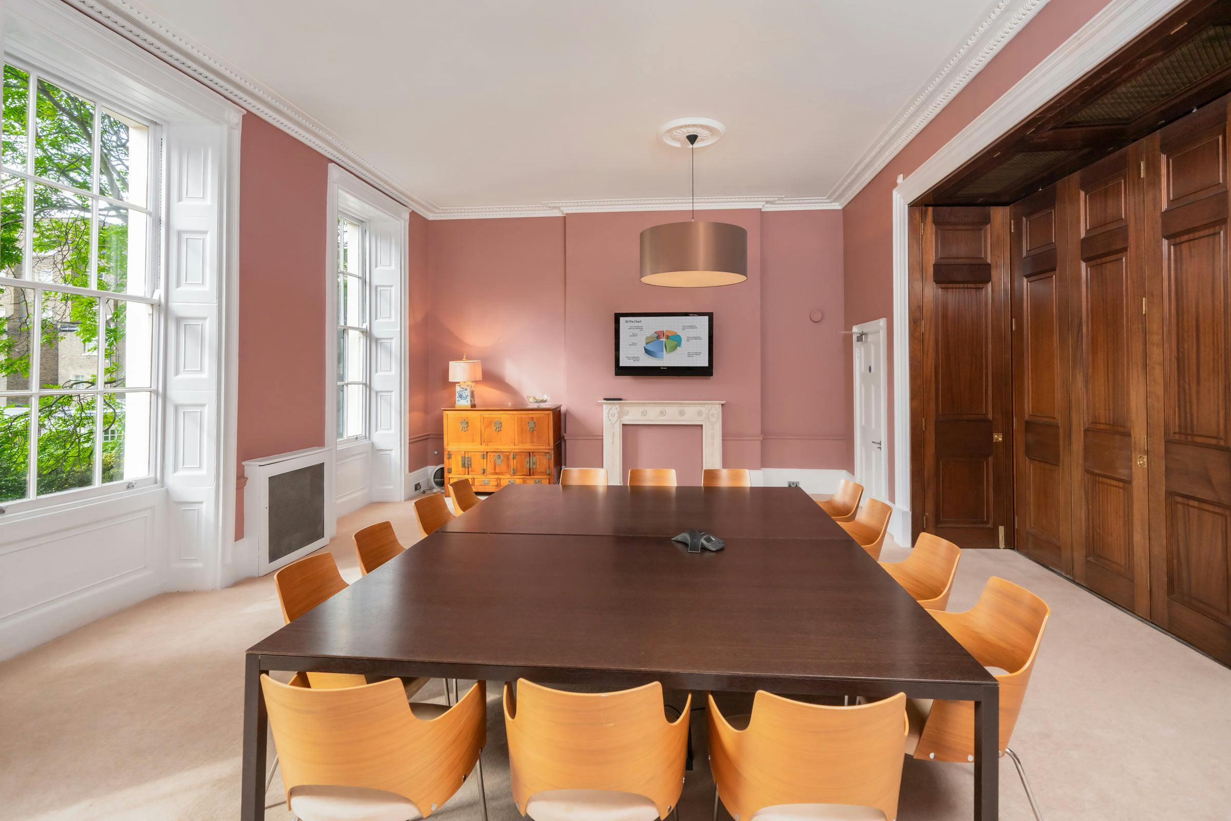 Russell Square Meeting Room with large table, ideal for corporate meetings and workshops.