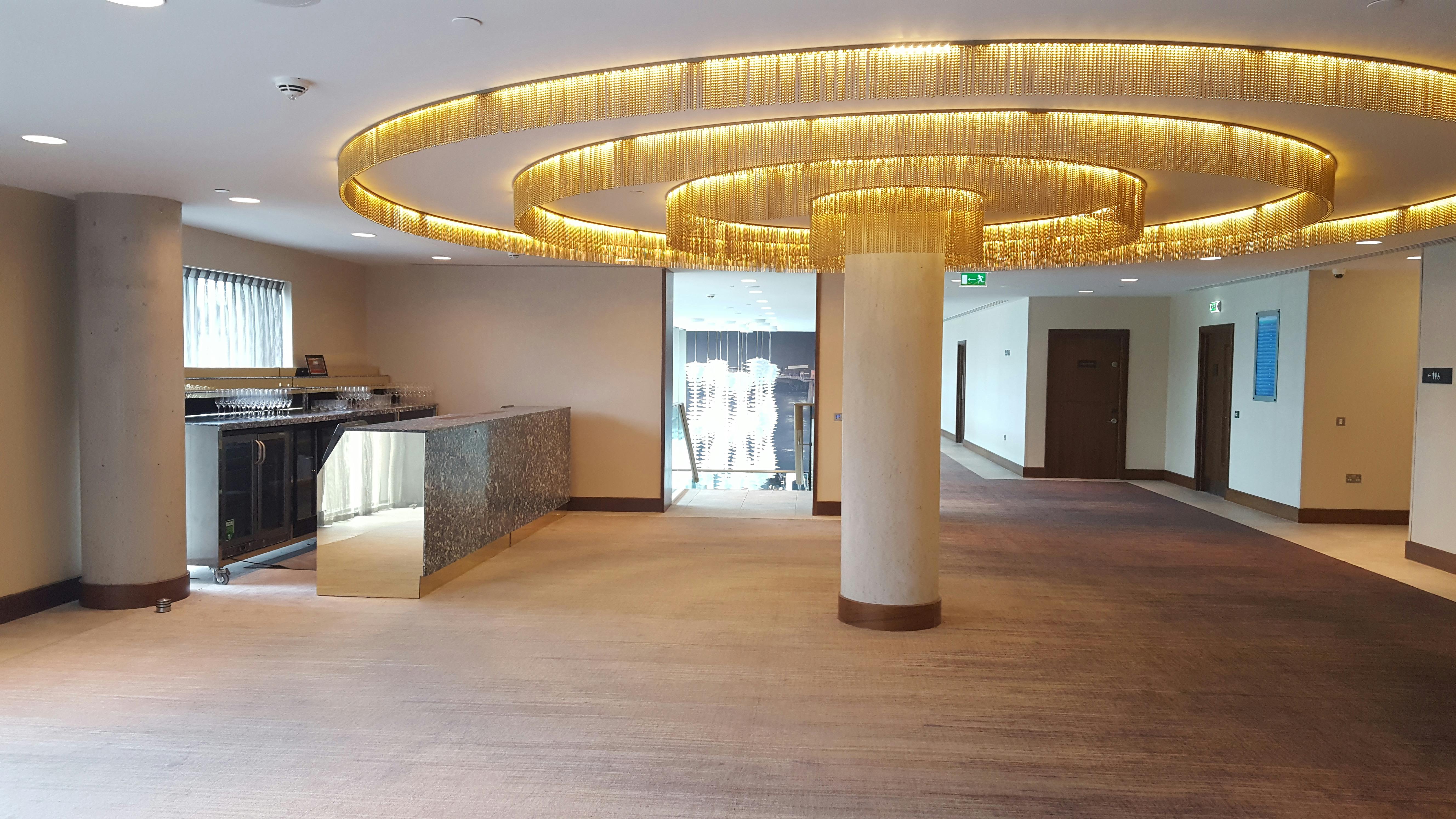 Modern event space in Hilton Bournemouth with elegant circular lighting for upscale gatherings.