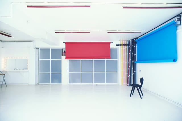 Versatile event space with bright white walls, ideal for workshops and meetings.