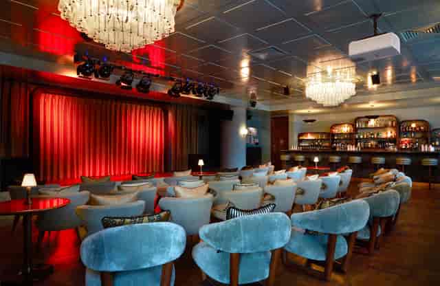 Stylish event space with plush seating for presentations and performances in White City Studio.