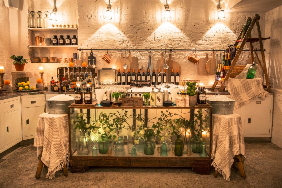 Private room bar setup with rustic charm for upscale events and cocktail receptions. - Banner