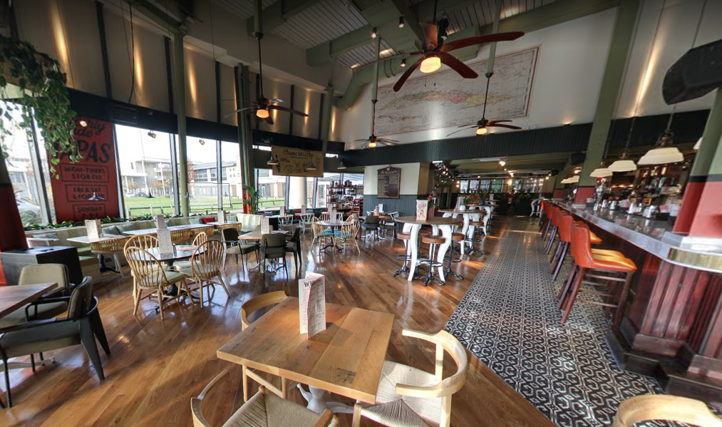 Spacious restaurant venue with stylish decor for casual meetings and events in Milton Keynes.