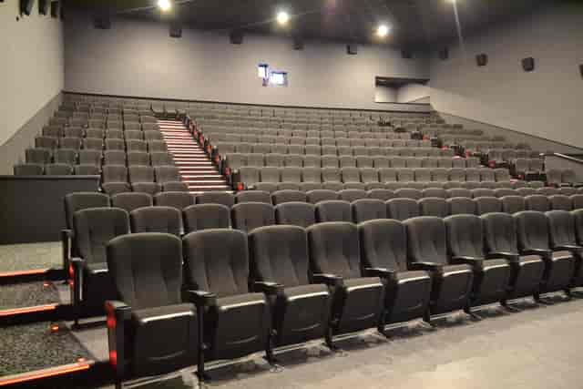 Modern Cineworld Wembley Screen 9 auditorium with tiered seating for corporate events.