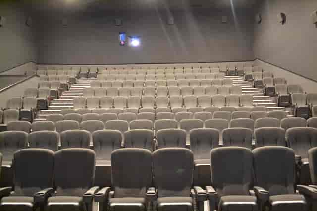 Cineworld Wembley Screen 5 auditorium with tiered seating for presentations and screenings.