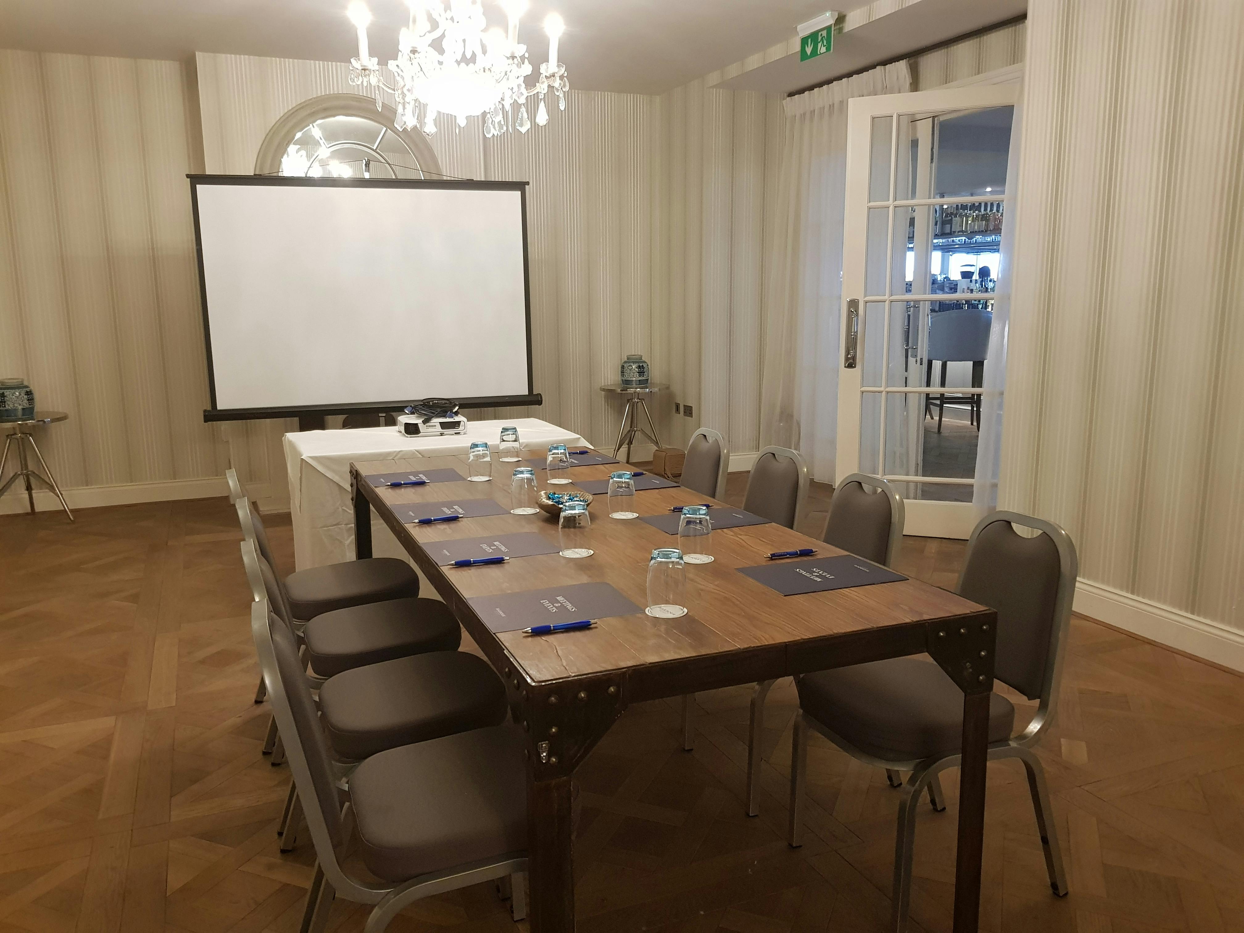 Harbour Suite meeting room at Sidmouth Harbour Hotel, elegant decor for professional events.