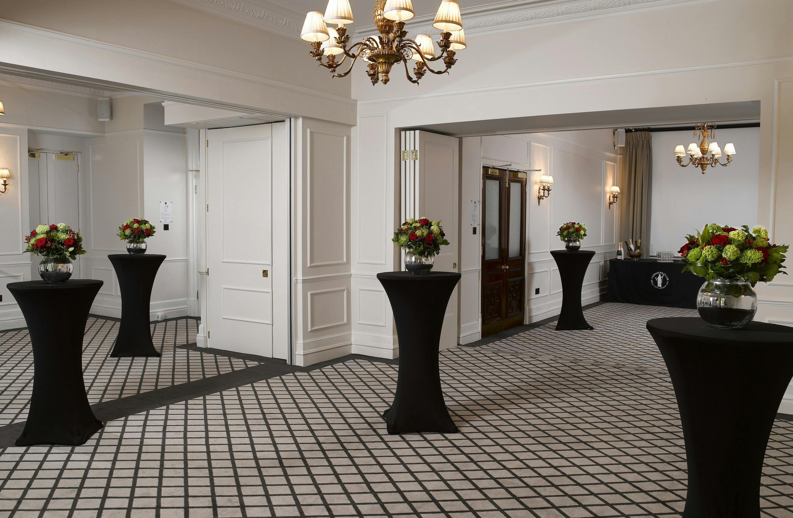 Elegant Farmers Suite event space with floral decor, ideal for networking receptions.
