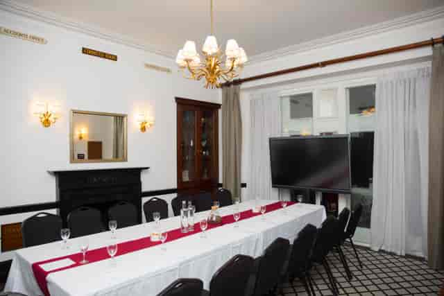 Boardroom at The Farmers Club with traditional decor for corporate meetings and business events.