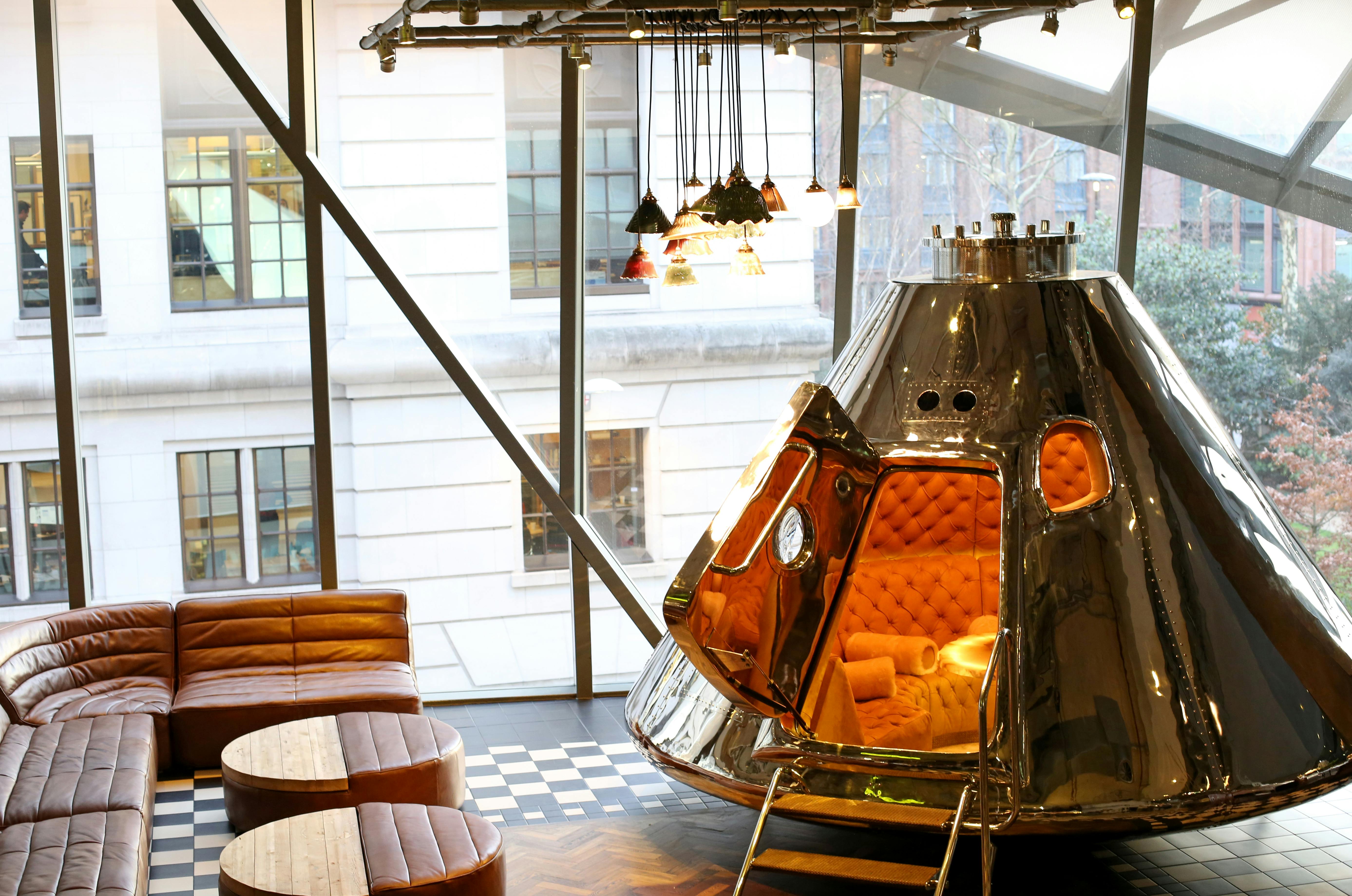 Innovative meeting space with sleek metallic design at Bread Street Kitchen, ideal for workshops.