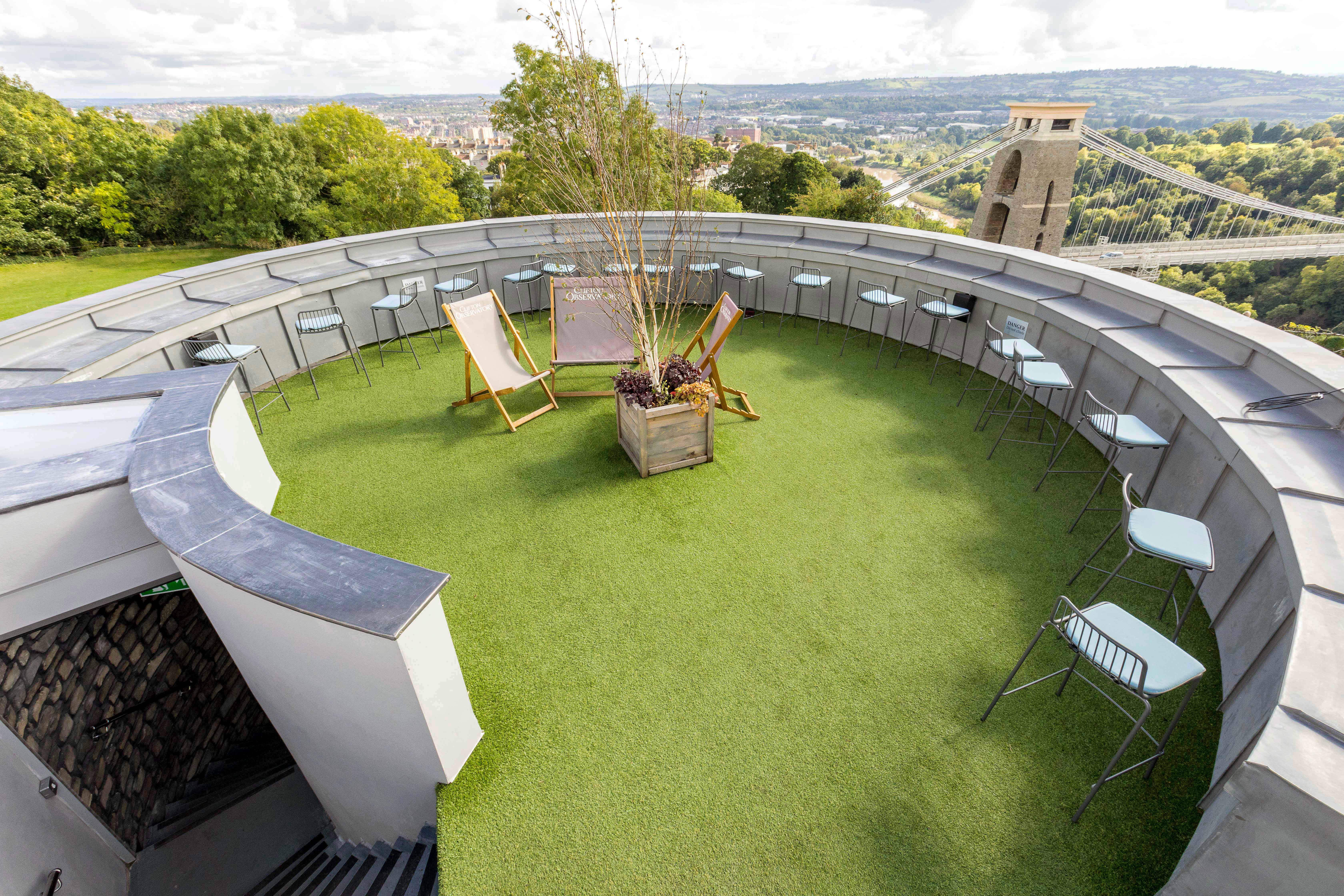 Stylish rooftop venue with turf, perfect for networking events at Clifton Observatory. - Banner