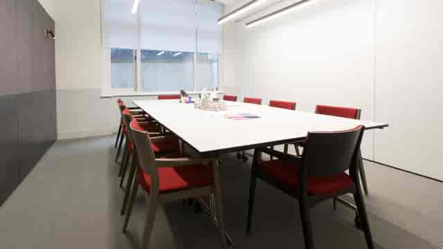 Minimalist boardroom at 3 Lloyds Avenue for internal project meetings and business briefings.