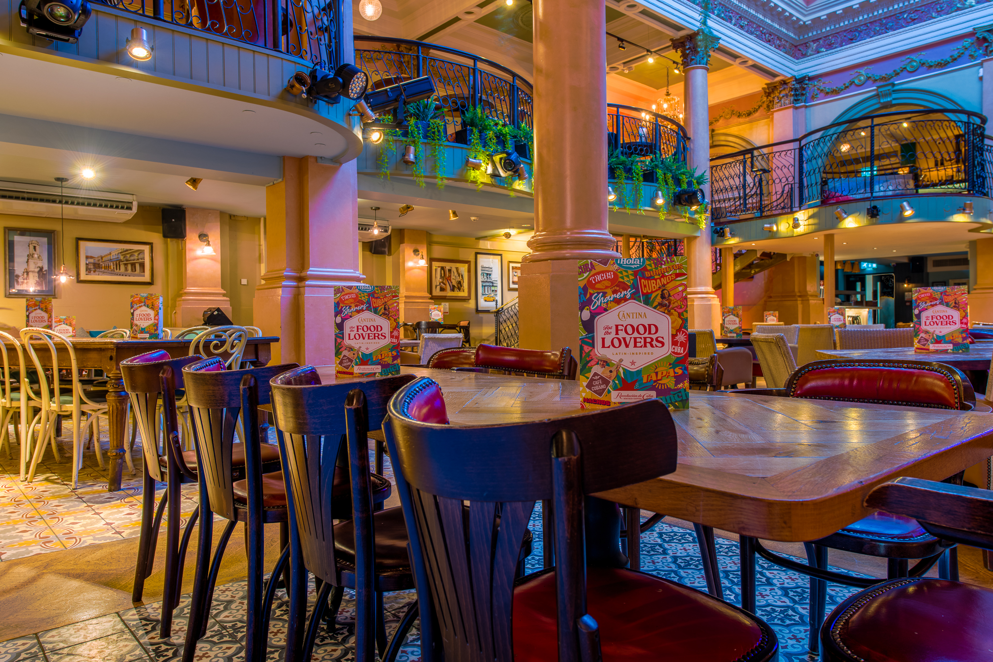 Vibrant Revolution De Cuba Belfast venue with colorful decor for casual events and gatherings. - Banner