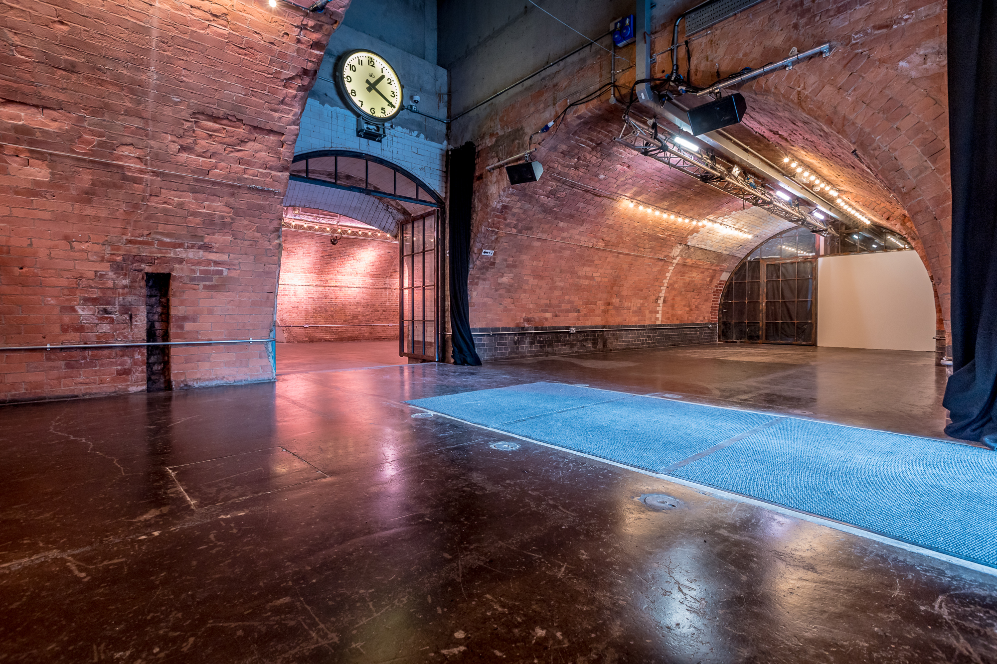 Versatile event space in Kachette Shoreditch with exposed brick arches, ideal for gatherings. - Banner