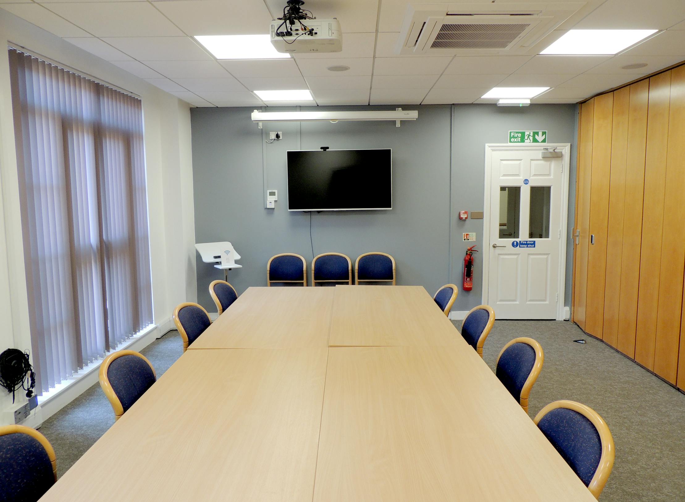 Meeting room with large table and ergonomic chairs for productive events in Bath Place.