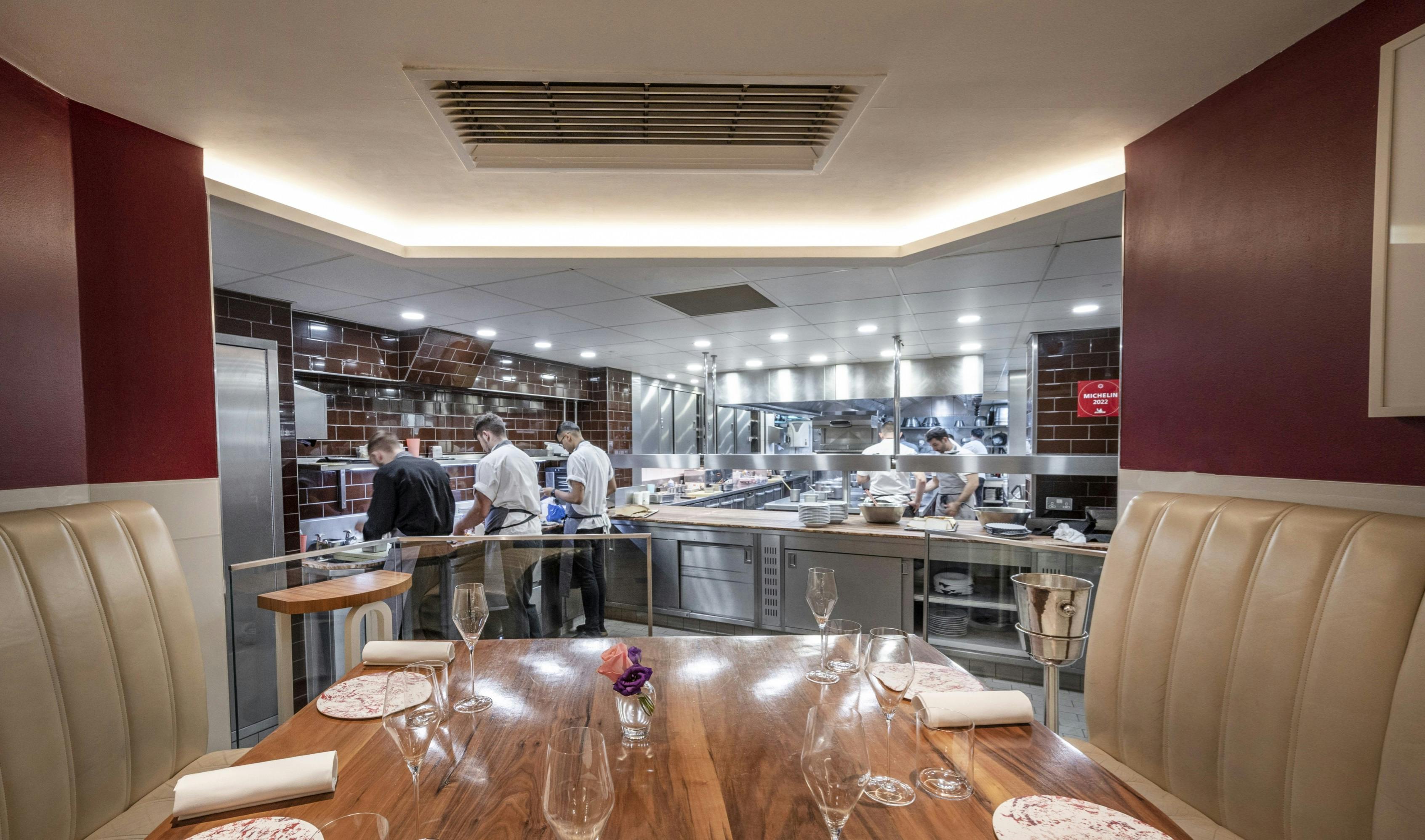 Modern kitchen table in Petrus, ideal for culinary events and private dining experiences.