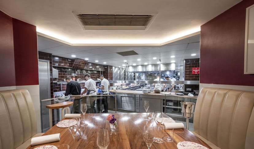 Modern kitchen table in Petrus, ideal for culinary events and private dining experiences.
