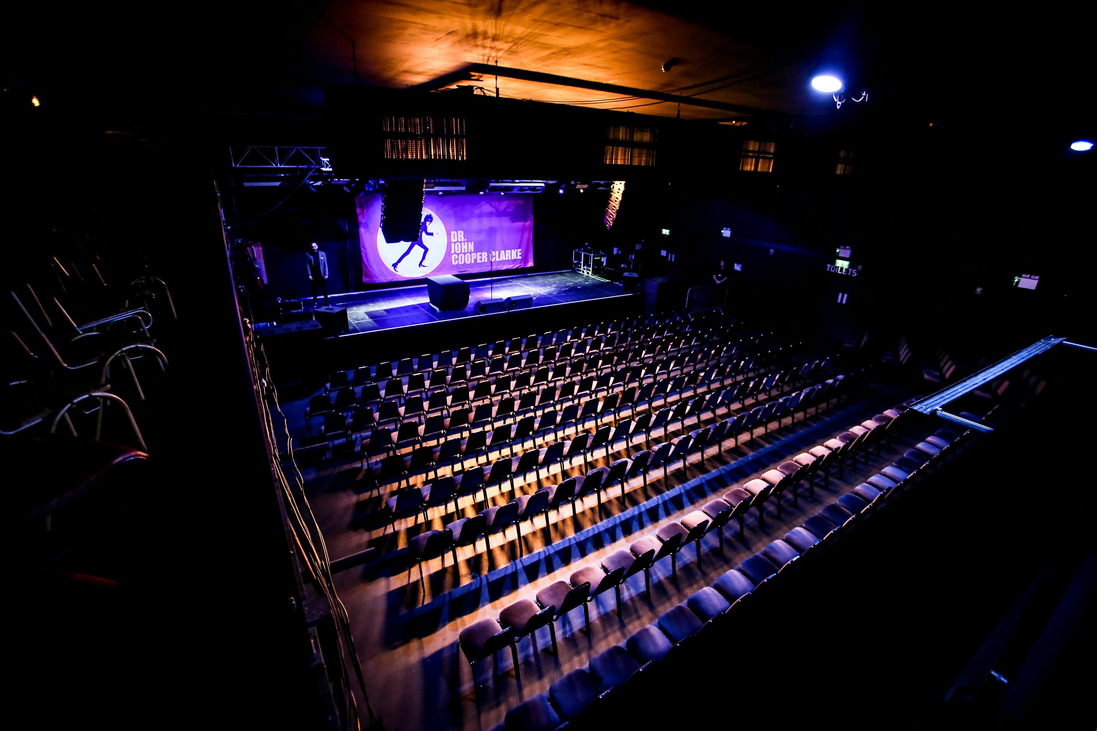 Main Room at Tramshed Cardiff with stage lighting, perfect for conferences and concerts.