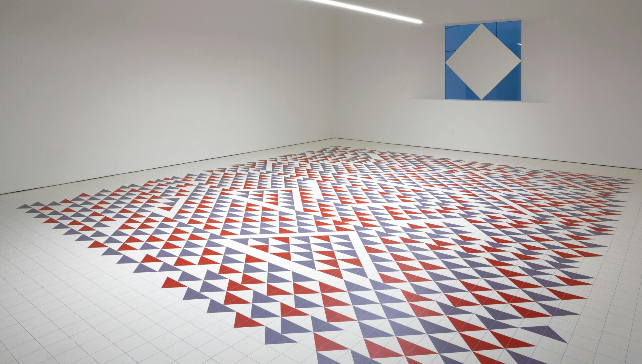 Albers Room: geometric red, white, and blue floor for creative workshops and events.
